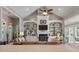Open living area with built-in shelving, fireplace, and large windows offering plenty of natural light at 3948 Gift Blvd, Johns Island, SC 29455