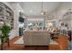 Inviting living room showcasing a fireplace, built-in shelves, and water views at 3948 Gift Blvd, Johns Island, SC 29455