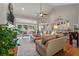 Cozy living room featuring fireplace, wood floors, and open access to a kitchen at 3948 Gift Blvd, Johns Island, SC 29455