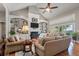 Bright living room with built-in shelving, fireplace, hardwood floors, and access to patio at 3948 Gift Blvd, Johns Island, SC 29455