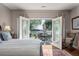 View from main bedroom through French doors to backyard deck and waterfront at 3948 Gift Blvd, Johns Island, SC 29455