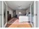 Spacious main bedroom featuring wood floors, ceiling fan, and a large patterned rug at 3948 Gift Blvd, Johns Island, SC 29455