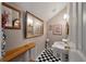 Tight half-bathroom featuring black and white tile floors, and gray walls at 3948 Gift Blvd, Johns Island, SC 29455