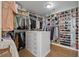 Spacious walk-in closet with custom shelving, drawers, and ample storage for clothes, shoes and accessories at 3948 Gift Blvd, Johns Island, SC 29455
