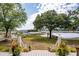 Scenic water view from a porch, enhanced with mature trees and marsh grass at 3948 Gift Blvd, Johns Island, SC 29455