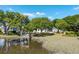 Waterfront homes with mature trees and private docks on a sunny day at 3948 Gift Blvd, Johns Island, SC 29455