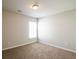 Bedroom with neutral walls, carpet, and a bright window providing natural light at 4021 Sanderson Ln, Summerville, SC 29483