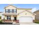 Charming two-story home with a black door, shutters and an attached two-car garage at 4021 Sanderson Ln, Summerville, SC 29483