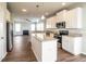 Open kitchen with stainless steel appliances, an island, and hardwood floors throughout at 4021 Sanderson Ln, Summerville, SC 29483