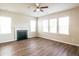 Bright Living room featuring hardwood floors, a fireplace and multiple windows for natural light at 4021 Sanderson Ln, Summerville, SC 29483