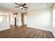 Spacious living area with hardwood floors, open to the kitchen with natural light and stairs to the upper level at 4021 Sanderson Ln, Summerville, SC 29483