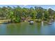Picturesque waterfront property with dock and gazebo, surrounded by mature trees at 423 Lake Moultrie Dr, Bonneau, SC 29431