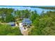 Aerial view features large waterfront lot, wooded privacy, and beautiful home at 423 Lake Moultrie Dr, Bonneau, SC 29431