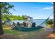 Inviting backyard space with lake views, hammock, and seating area at 423 Lake Moultrie Dr, Bonneau, SC 29431