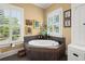Bathroom with a tiled tub and a window bringing in light and views at 423 Lake Moultrie Dr, Bonneau, SC 29431