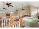 Bedroom with vaulted ceilings, ceiling fans and bright window lighting at 423 Lake Moultrie Dr, Bonneau, SC 29431