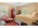 Cozy bedroom with a chair and large bed with side tables at 423 Lake Moultrie Dr, Bonneau, SC 29431