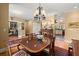 Lovely dining room with hardwood floors and direct access to the office and kitchen at 423 Lake Moultrie Dr, Bonneau, SC 29431