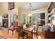 Charming dining room with water view, a fireplace, and natural light at 423 Lake Moultrie Dr, Bonneau, SC 29431