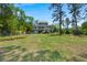 Charming home with a large yard and lush greenery at 423 Lake Moultrie Dr, Bonneau, SC 29431