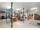 Large garage space with storage, a workbench, and access to utilities at 423 Lake Moultrie Dr, Bonneau, SC 29431
