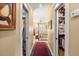 Hallway view to a main bedroom with closets on either side with a carpeted floor at 423 Lake Moultrie Dr, Bonneau, SC 29431