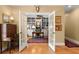 Elegant home office featuring custom built-ins, a ceiling fan, and french doors to the rest of the house at 423 Lake Moultrie Dr, Bonneau, SC 29431