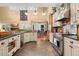 Bright, open kitchen with stainless steel appliances and a view of the dining area at 423 Lake Moultrie Dr, Bonneau, SC 29431