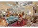 Open-concept living room featuring loft, kitchen view, and staircase at 423 Lake Moultrie Dr, Bonneau, SC 29431
