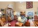 Open living room with a fireplace, water view, and comfortable seating at 423 Lake Moultrie Dr, Bonneau, SC 29431