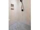 Modern walk-in shower with stylish tile and convenient built-in storage niches at 423 Lake Moultrie Dr, Bonneau, SC 29431