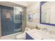 Modern bathroom featuring a walk-in shower with blue subway tiles and stylish fixtures, offering a spa-like experience at 4233 Mariners Watch, Johns Island, SC 29455