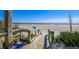 Private beach access with boardwalk leading to sandy shores, outdoor shower, and clear ocean views at 4233 Mariners Watch, Johns Island, SC 29455