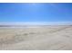 Wide, sandy beach on a clear day, offering a serene and open view of the ocean at 4233 Mariners Watch, Johns Island, SC 29455