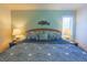 Cozy bedroom featuring nautical decor, including a decorative fish wall mount and maritime inspired bedding at 4233 Mariners Watch, Johns Island, SC 29455