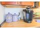 Butcher block countertops feature a Keurig coffee maker and decorative sugar and coffee jars, conveniently located near the stovetop at 4233 Mariners Watch, Johns Island, SC 29455