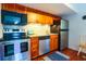 Modern kitchen with stainless steel appliances, granite countertops, and wood cabinets at 4233 Mariners Watch, Johns Island, SC 29455