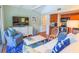 Comfortable living room featuring a large TV, blue accents, and an open floor plan at 4233 Mariners Watch, Johns Island, SC 29455