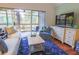 Inviting living room featuring comfortable seating, a TV, and a private balcony at 4233 Mariners Watch, Johns Island, SC 29455