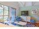 Cozy living room featuring a TV, comfortable seating, and access to a private balcony at 4233 Mariners Watch, Johns Island, SC 29455