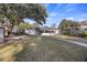 Spacious backyard showcasing the home's rear exterior and mature trees at 4765 S Constellation Dr, North Charleston, SC 29418