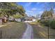 Backyard with a brick path leading to the house, perfect for outdoor enjoyment at 4765 S Constellation Dr, North Charleston, SC 29418
