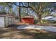 Backyard featuring storage sheds, mature trees, and a well-manicured yard at 4765 S Constellation Dr, North Charleston, SC 29418