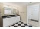Bathroom with black and white floors, new vanity, mirrors, and lighting fixtures at 4765 S Constellation Dr, North Charleston, SC 29418