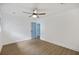 A light and airy bedroom features luxury vinyl plank flooring and doors to the en suite bathroom at 4765 S Constellation Dr, North Charleston, SC 29418
