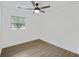 A spacious bedroom with luxury vinyl plank flooring and a modern ceiling fan at 4765 S Constellation Dr, North Charleston, SC 29418