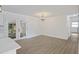 View of a dining area featuring French doors, stylish lighting, and neutral walls at 4765 S Constellation Dr, North Charleston, SC 29418