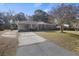 Charming brick home with an attached carport and well-maintained front yard at 4765 S Constellation Dr, North Charleston, SC 29418