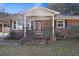 Inviting brick front porch with decorative railing and a charming entrance at 4765 S Constellation Dr, North Charleston, SC 29418