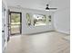 Bright living space featuring new floors and large windows offering a picturesque view of the front yard at 4765 S Constellation Dr, North Charleston, SC 29418